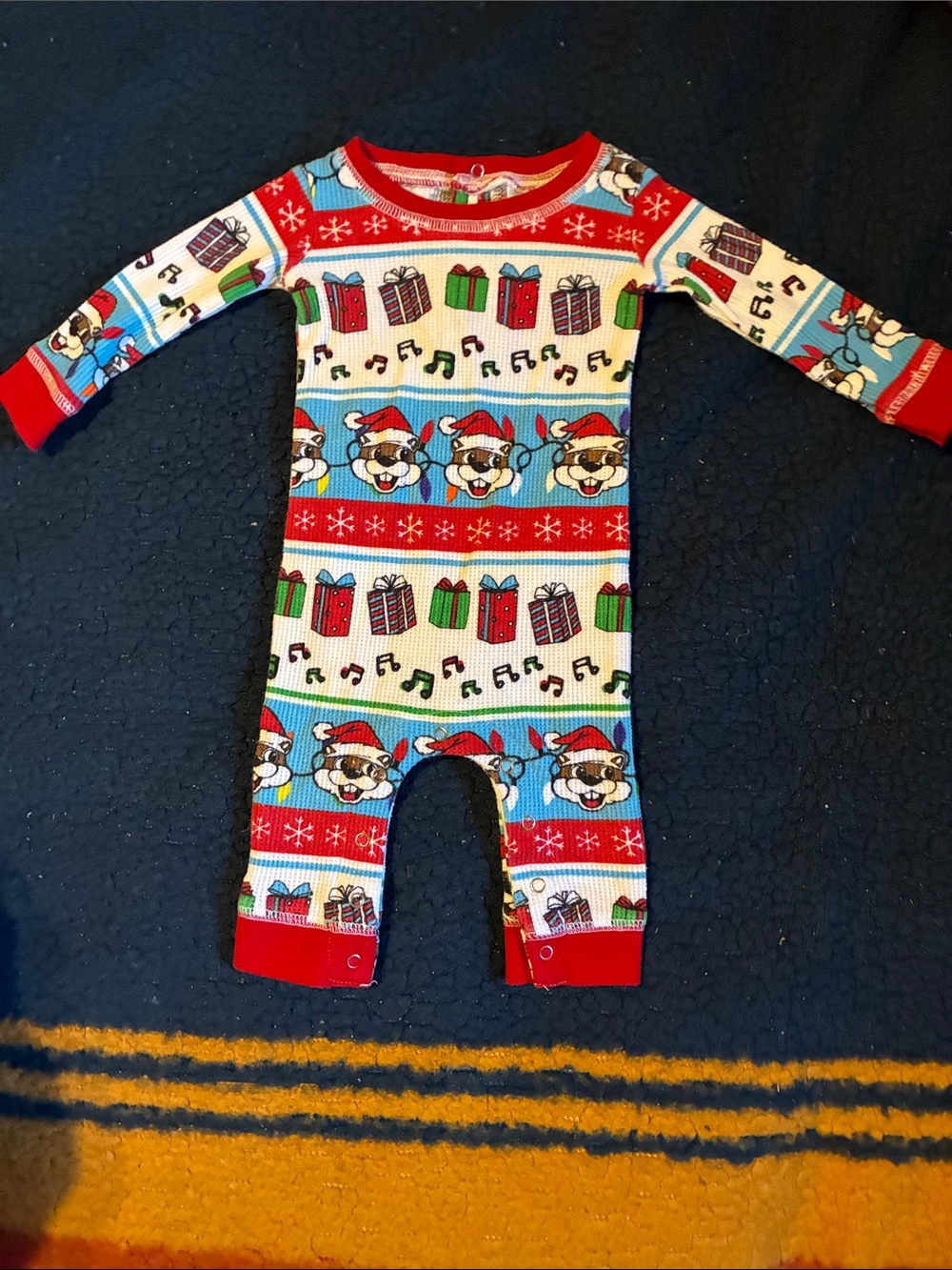 Buc-ee’s Festive Puppy Print Kids One-Piece Footie - Red, Blue & Green
